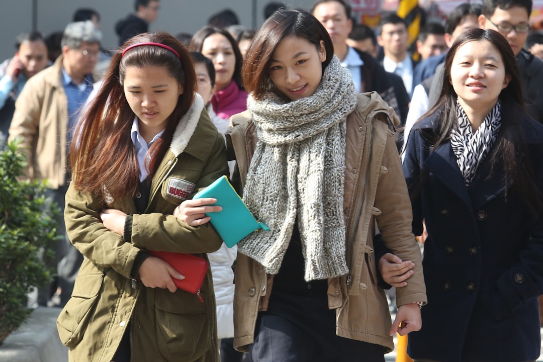 Office workers cross the road looking for lunch in Taiwan January 14,2013.